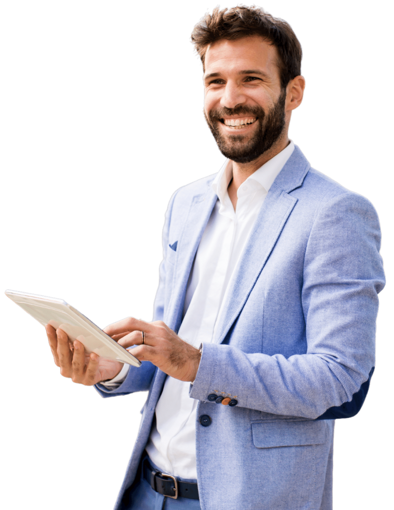 Smiling man in a light blue blazer holding a tablet toward the camera.